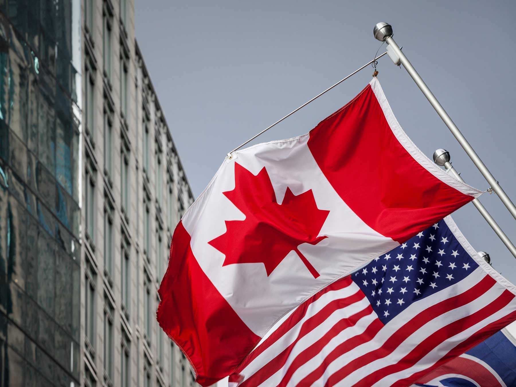 Canada and US Flags Canadian Immigration Lawyers